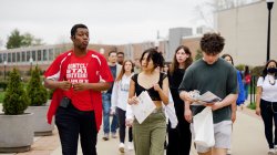Richard Steiner-Otoo leads prospective students around campus.